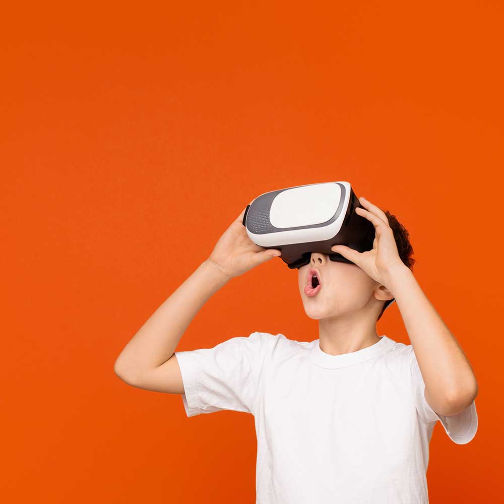 A boy wearing VR goggles.